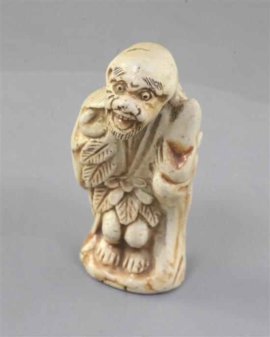 A Japanese porcelain netsuke a Sennin, 19th century, 5.3cm (no. 555)